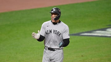 Oct 18, 2024; Cleveland, Ohio, USA; New York Yankees outfielder Aaron Judge (99) celebrates scoring on a three run home run by designated hitter Giancarlo Stanton (not pictured) in the sixth inning against the Cleveland Guardians during game four of the ALCS for the 2024 MLB playoffs at Progressive Field. Mandatory Credit: David Richard-Imagn Images