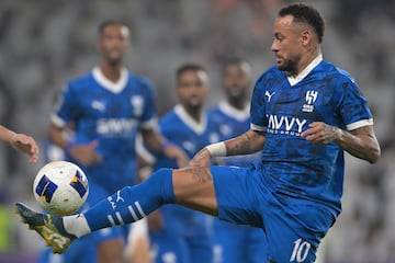 (FILES) Hilal's Brazilian forward #10 Neymar controls the ball during the AFC Champions League group B football match between UAE's Al-Ain and Saudi's Al-Hilal at the Hazza bin Zayed Stadium in al-Ain on October 21, 2024. Brazilian star Neymar on January 27, 2025 ended his injury-plagued 18-month stay in Saudi Arabia as his club, Al-Hilal said they had "agreed to terminate the player's contract by mutual consent". The 32-year-old former Barcelona and Paris Saint-Germain forward  played just seven times since joining the club in August 2023, despite a reported salary of around $104 million a year. (Photo by AFP)