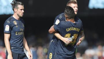 Real Madrid's Toni Kroos, top right, celebrates after scoring his side's second goal with Casemiro during La Liga soccer match between Celta and Real Madrid at the Balaídos Stadium in Vigo, Spain, Saturday, Aug. 17, 2019. (AP Photo/Luis V