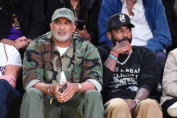 Phil Handy, entrenador de baloncesto estadounidense, Kyrie Irving, jugador de baloncesto estadounidense que pertenece a la plantilla de los Dallas Mavericks.