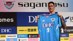 Spanish football star Fernando Torres displays his new jersey during a press conference welcoming him to the J-League club team Sagan Tosu, in Tokyo on July 15, 2018.
 The former Liverpool, Chelsea and Spain striker left Atletico Madrid this summer after 