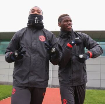 Anthony Martial and Paul Pogba of Manchester United at the Aon Training Complex in Manchester yesterday.