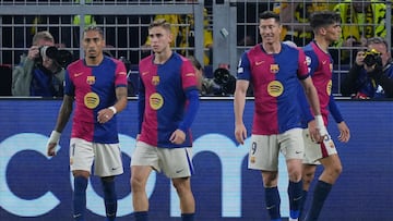 Barcelona players celebrate the 2-1 goal during the UEFA Champions League quarter-final second leg football match between BVB Borussia Dortmund and FC Barcelona in Dortmund, western Germany on April 15, 2025. (Photo by Pau BARRENA / AFP)