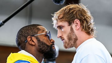 Former world welterweight king Floyd Mayweather (L) and YouTube personality Logan Paul face-off during the media availability ahead of their June 6 exhibition boxing match, on June 3, 2021 at Villa Casa Casuarina at the former Versace Mansion in Miami Bea