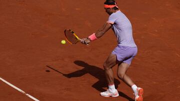 Spain's Rafael Nadal returns the ball to Australia's Alex De Minaur during the ATP Barcelona Open "Conde de Godo" tennis tournament singles match at the Real Club de Tenis in Barcelona, on April 17, 2024. (Photo by Pau BARRENA / AFP)