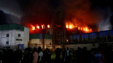 Flames rise after a fire broke out at a factory named Hashem Foods Ltd. in Rupganj of Narayanganj district, outskirts of Dhaka, Bangladesh, July 9, 2021. REUTERS/Mohammad Ponir Hossain