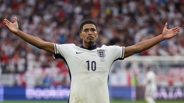 England's midfielder #10 Jude Bellingham celebrates scoring his team's first goal during the UEFA Euro 2024 round of 16 football match between England and Slovakia at the Arena AufSchalke in Gelsenkirchen on June 30, 2024. (Photo by Adrian DENNIS / AFP)