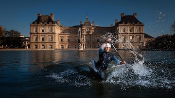 (FILES) France's canoeist Marjorie Delassus poses inside the fountain of the Jardin du Luxembourg (Luxembourg Garden) with the French Senate in the background in Paris on March 25, 2024, ahead of the Paris 2024 Olympic and Paralympic games. Since 1799, the Palais du Luxembourg (Luxembourg palace) has been home to the Senate, the upper chamber of the French Parliament . From 1879, the Jardin du Luxembourg (Luxembourg Garden) has been assigned to the Senate, which is responsible for its management, supervision and conservation. (Photo by Jo�l SAGET / AFP) / RESTRICTED TO EDITORIAL USE