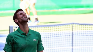 Serbian tennis player Novak Djokovic reacts during an exhibition match, organised to mark the opening of a tennis court at the "Archaeological park of the Bosnian pyramid" near Visoko, north of Sarajevo, on July 13, 2022. (Photo by ELVIS BARUKCIC / AFP)