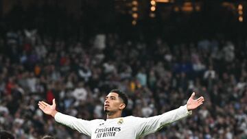 Real Madrid's English midfielder #05 Jude Bellingham celebrates scoring his team's first goal from the penalty spot during the Spanish league football match between Real Madrid CF and Getafe CF at the Santiago Bernabeu stadium in Madrid on December 1, 2024. (Photo by JAVIER SORIANO / AFP)