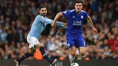 Leicester City&#039;s English defender Harry Maguire (R) goes past Manchester City&#039;s German midfielder Ilkay Gundogan (L) during the English Premier League football match between Manchester City and Leicester City at the Etihad Stadium in Manchester,