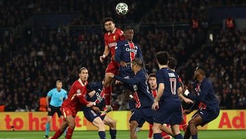 Liverpool's Colombian forward #07 Luis Diaz (CL) and Paris Saint-Germain's Portuguese defender #25 Nuno Mendes (CR) fight for the ball in the air during the UEFA Champions League Round of 16 first leg football match between Paris Saint-Germain (FRA) and Liverpool (ENG) at the Parc des Princes stadium in Paris on March 5, 2025. (Photo by Anne-Christine POUJOULAT / AFP)