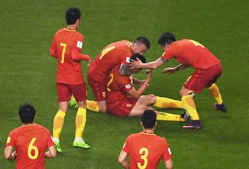 Chinese players celebrate after Yu Dabao (top C) scored during their World Cup football qualifying match against South Korea in Changsha.