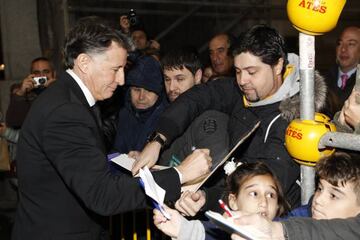 Sebastian Coe signs autographs for waiting fans before the event.