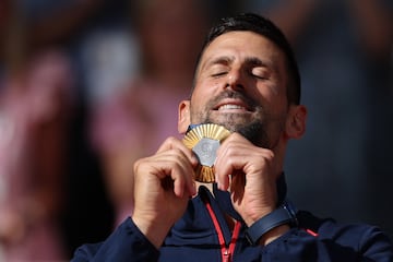 Champion | Novak Djokovic and his medal.
