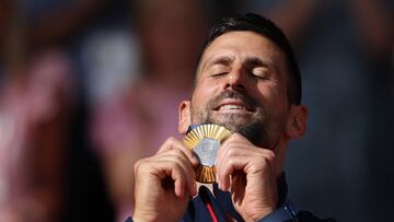 Paris 2024 Olympics - Tennis - Men's Singles Victory Ceremony - Roland-Garros Stadium, Paris, France - August 04, 2024. Gold medallist Novak Djokovic of Serbia holds his medal. REUTERS/Claudia Greco