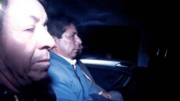 LIMA, PERU - DECEMBER 07: Peru's former President Pedro Castillo (2nd L) is seen inside a police car as he leaves the headquarters of the Prefecture, where Castillo is under detention in Lima, Peru on December 07, 2022. Announcing the dissolution of Congress and the establishment of an emergency government, President Pedro Castillo was removed from his post and taken into custody by the Congress. (Photo by John Reyes/Anadolu Agency via Getty Images)
