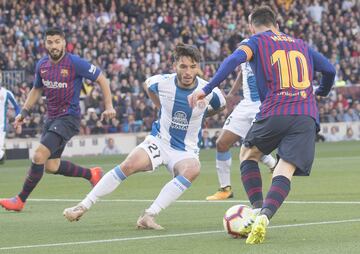 Lluis (RCD Espanyol) y Lionel Messi (FC Barcelona)