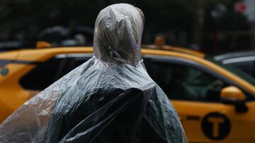 A person wears a rain poncho during wet weather in New York City, U.S., September 26, 2023.  REUTERS/Shannon Stapleton