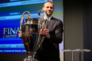 UEFA President Aleksander Ceferin poses with the UEFA Champions League trophy