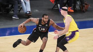 Apr 12, 2021; New York, New York, USA; New York Knicks guard Alec Burks (18) drives against Los Angeles Lakers guard Alex Caruso (right) in the first quarter at Madison Square Garden. Mandatory Credit: Wendell Cruz-USA TODAY Sports