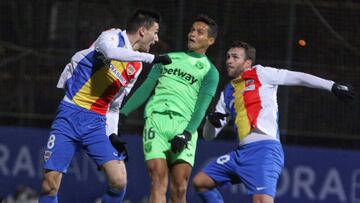 GRAF1051. ANDORRA LA VELLA, 17/12/2019.- Los jugadores del FC Andorra Martí Riverola (i) y Ludo Clemente (d) saltan por el balón con José Arnáiz, delantero del CD Leganés, durante el partido de Copa del Rey que se juega