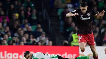 Real Betis' French midfielder Nabil Fekir (L) falls down next to Athletic Bilbao's Spanish defender Oscar De Marcos during the Spanish League football match between Real Betis and Athletic Club Bilbao at the Ramon Sanchez Pizjuan stadium in Seville on December 29, 2022. (Photo by CRISTINA QUICLER / AFP) (Photo by CRISTINA QUICLER/AFP via Getty Images)