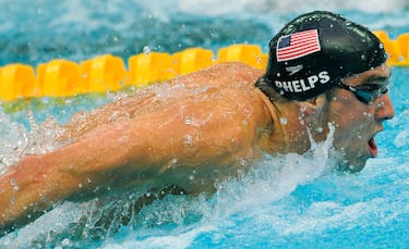 When did Michael Phelps retire? How many Olympic medals did he win?