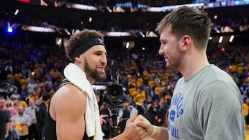 Dallas Mavericks guard Luka Doncic (77) with Golden State Warriors guard Klay Thompson (11) after game five of the 2022 western conference finals against the Dallas Mavericks at Chase Center.