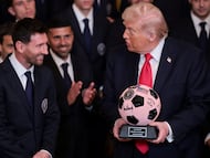 U.S. President Donald Trump is gifted a jewelled soccer ball with his signature on it from Inter Miami CF captain Lionel Messi, on the day he honors reigning Major League Soccer (MLS) champion Inter Miami CF players and team officials with an event in the East Room of the White House in Washington, D.C., U.S., March 5, 2026. REUTERS/Jonathan Ernst