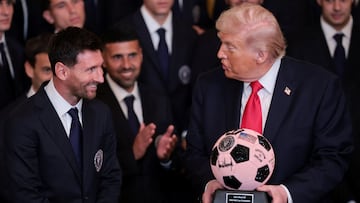 U.S. President Donald Trump is gifted a jewelled soccer ball with his signature on it from Inter Miami CF captain Lionel Messi, on the day he honors reigning Major League Soccer (MLS) champion Inter Miami CF players and team officials with an event in the East Room of the White House in Washington, D.C., U.S., March 5, 2026. REUTERS/Jonathan Ernst