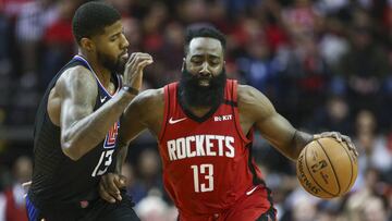 Mar 5, 2020; Houston, Texas, USA; Houston Rockets guard James Harden (13) drives with the ball as Los Angeles Clippers guard Paul George (13) defends during the second quarter at Toyota Center. Mandatory Credit: Troy Taormina-USA TODAY Sports