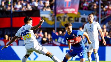 BUENOS AIRES, ARGENTINA - MAY 07: Lucas Menossi of Tigre fights for the ball with Cristian Medina of Boca Juniors during a match between Tigre and Boca Juniors as part of Copa de la Liga 2022 at Jose Dellagiovanna on May 7, 2022 in Buenos Aires, Argentina. (Photo by Marcelo Endelli/Getty Images)