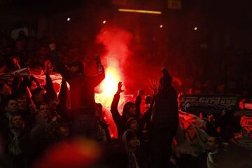 Noisy St Etienne fans light flares in Old Trafford.