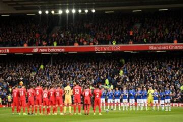 LIVERPOOL, ENGLAND - APRIL 01: Fans, players and officals observe a minutes silence for ex-Liverpool player Ronnie Moran who passsed away last week prior to the Premier League match between Liverpool and Everton