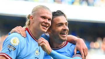 MANCHESTER, ENGLAND - OCTOBER 02: Erling Haaland of Manchester City celebrates their sides fifth goal and their hat trick with team mate Jack Grealish during the Premier League match between Manchester City and Manchester United at Etihad Stadium on October 02, 2022 in Manchester, England. (Photo by Michael Regan/Getty Images)