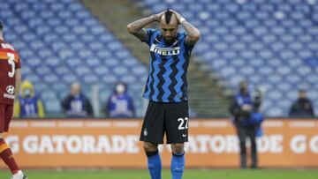 Inter Milan's Arturo Vidal reacts after Roma's Lorenzo Pellegrini scores his side's first goal during a Serie A soccer match between Roma and Inter Milan, at Rome's Olympic Stadium, Sunday, Jan. 10, 2021. (AP Photo/Gregorio Borgia)