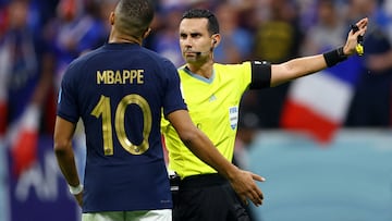 Soccer Football - FIFA World Cup Qatar 2022 - Semi Final - France v Morocco - Al Bayt Stadium, Al Khor, Qatar - December 14, 2022 Referee Cesar Arturo Ramos signals as France's Kylian Mbappe reacts REUTERS/Molly Darlington