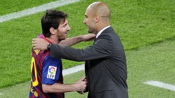 Barcelona&#039;s Argentinian forward Lionel Messi (L) celebrates with Barcelona&#039;s coach Josep Guardiola after scoring a goal during the Spanish league football match FC Barcelona vs RCD Espanyol on May 5, 2012 at the Camp Nou stadium in Barcelona. AF
