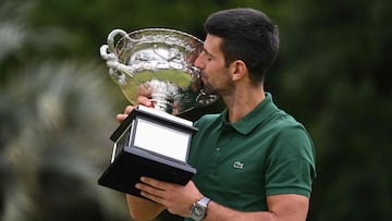 Serbia's Novak Djokovic celebrates with the Norman Brookes Challenge Cup trophy a day after his victory against Greece's Stefanos Tsitsipas in the men's singles final match of the Australian Open tennis tournament in Melbourne on January 30, 2023. (Photo by WILLIAM WEST / AFP) / -- IMAGE RESTRICTED TO EDITORIAL USE - STRICTLY NO COMMERCIAL USE --