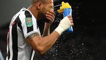 NEWCASTLE UPON TYNE, ENGLAND - JANUARY 10: Newcastle player Joelinton sprays his face with water prior to the Carabao Cup Quarter Final match between Newcastle United and Leicester City at St James' Park on January 10, 2023 in Newcastle upon Tyne, England. (Photo by Stu Forster/Getty Images)