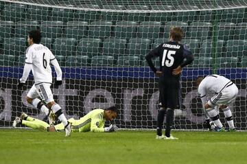 Real goalkeeper Navas (second left) reacts after conceding in Warsaw.