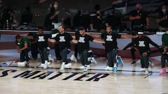 Aug 19, 2020; Lake Buena Vista, Florida, USA; Coaches and players kneel during the national anthem before game two of the first round of the 2020 NBA Playoffs between the Utah Jazz and the Denver Nuggets at AdventHealth Arena. Mandatory Credit: Kim Klement-USA TODAY Sports