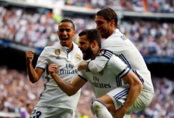 Nacho celebrates with Sergio Ramos and Danilo.