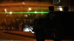 Demonstrators clash with riot police during a protest against the government of Colombian President Ivan Duque in Bogota on June 12, 2021. - Dozens of people have been killed in protests that erupted around the country on April 28, initially against a tax hike that would have mostly affected the middle classes, but which have morphed into a major anti-government movement. (Photo by Juan BARRETO / AFP)