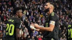 Real Madrid's French forward Karim Benzema celebrates scoring his team's first goal next to Real Madrid's Brazilian forward Vinicius Junior (L) during the Spanish League football match between Real Valladolid FC and Real Madrid CF at the Jose Zorilla stadium in Valladolid on December 30, 2022. (Photo by CESAR MANSO / AFP)