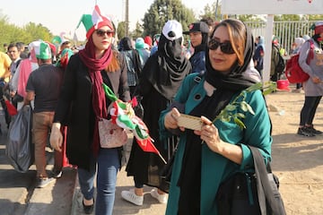 Female football fans make their way to Azadi Stadium in Tehran after a 40-year ban was lifted by the Iranian Football Federation.