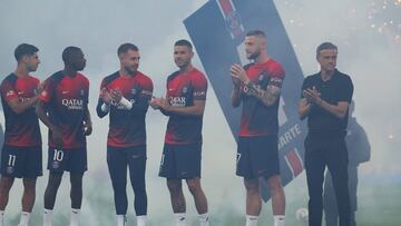 (L-R) Paris Saint-Germain's Spanish forward #11 Marco Asensio, Paris Saint-Germain's French forward #10 Ousmane Dembele, Paris Saint-Germain's Spanish goalkeeper #80 Arnau Tenas, Paris Saint-Germain's French defender #21 Lucas Hernandez, Paris Saint-Germain's Slovak defender #37 Milan Skriniar and Paris Saint-Germain's Spanish headcoach Luis Enrique stand during a presentation of new players to the fans ahead of the French L1 football match between Paris Saint-Germain (PSG) and RC Lens at the Parc des Princes Stadium in Paris on August 26, 2023. (Photo by Alain JOCARD / AFP)