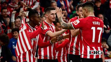 Athletic Bilbao players celebrate the opening goal scored by Spanish forward #07 Alex Berenguer during the Spanish league football match between Athletic Club Bilbao and Real Sociedad at the San Mames stadium in Bilbao on January 13, 2024. (Photo by ANDER GILLENEA / AFP)