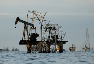 FILE PHOTO: Abandoned pumpjacks damaged over time at a field of state oil company PDVSA on Lake Maracaibo, as residents around the oil‑rich center of Maracaibo in Zulia state remain uncertain about new investments following recent legislative reforms allowing greater private participation in PDVSA and aimed at revitalizing the country’s struggling oil sector, in Cabimas, Venezuela, January 27, 2026. REUTERS/Leonardo Fernandez Viloria/File Photo/File Photo